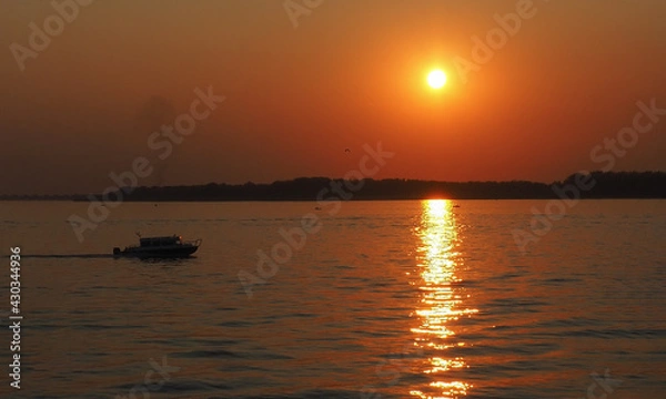 Fototapeta river landscape at sunset