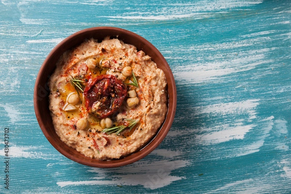 Obraz vegan food. hummus with sun dried tomatoes and smoked paprika