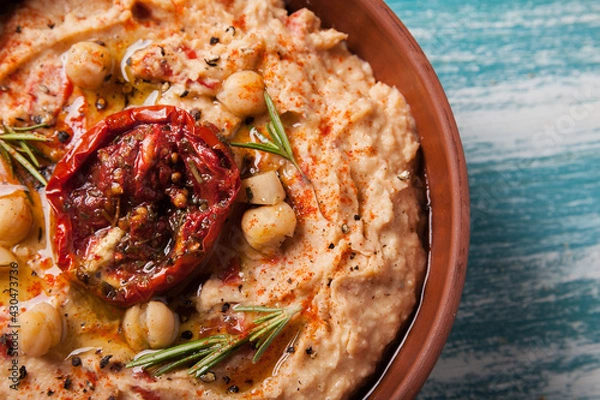 Obraz vegan food. close-up hummus with sun dried tomatoes and smoked paprika