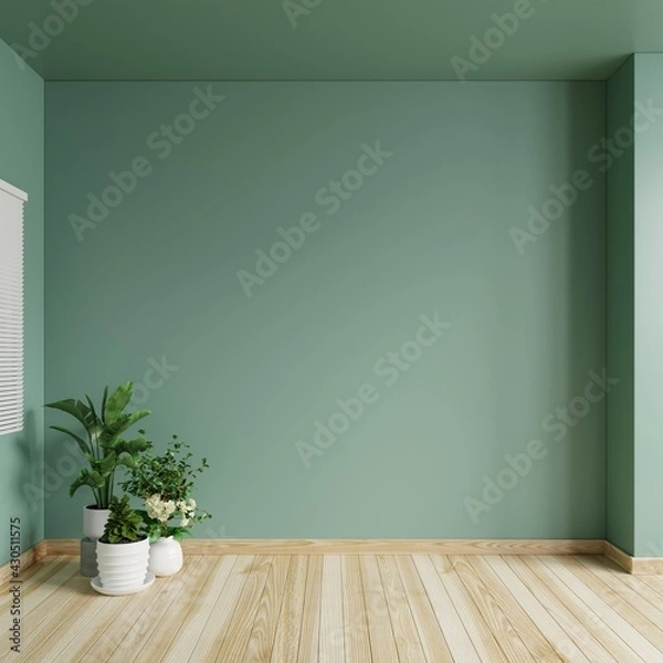 Obraz Living room with green walls is empty, decorated with potted plants on the wooden floor.3d rendering.