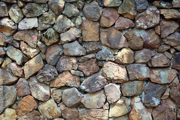 Obraz the stone wall at the park with sunlight  and shadow