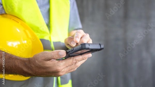 Fototapeta construction texting text message on smartphone