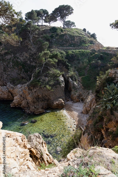 Fototapeta Creek in the mediterranean sea. Small private beach hidden in the rocks