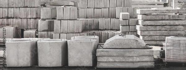 Obraz Storage of concrete blocks in a warehouse. Concrete structures at the construction site. Industrial, building cement materials