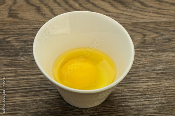 Fototapeta Raw Chicken egg in the bowl