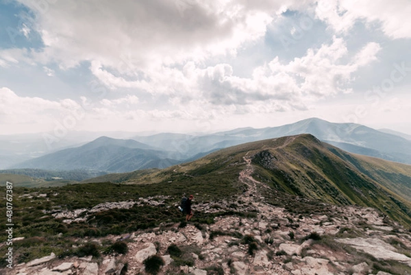 Obraz Tourist Group on the Mountain Trail Hike Backpacking