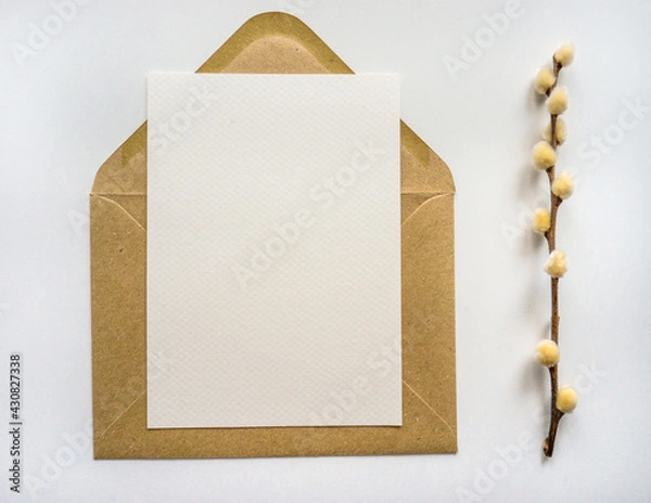 Obraz Mockup card with kraft envelope and dry plant