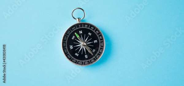 Obraz compass on a blue background