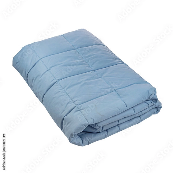Fototapeta The blue cotton blanket is folded several times. White isolated background. Side view
