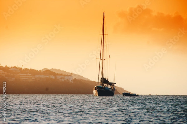 Obraz island sunset with boat