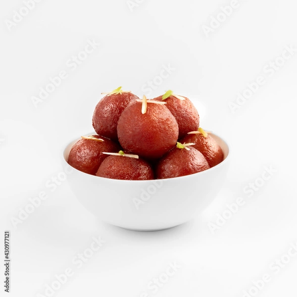 Fototapeta gulabjaamun or gulaabjamun in a white bowl on white background useful for food product packaging or social media.
