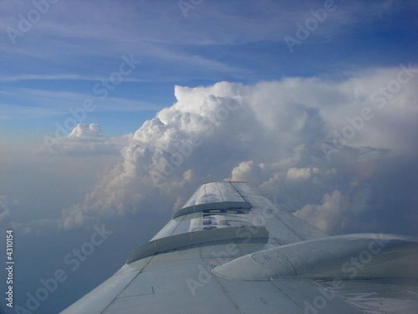 Obraz Plane wing above the clouds