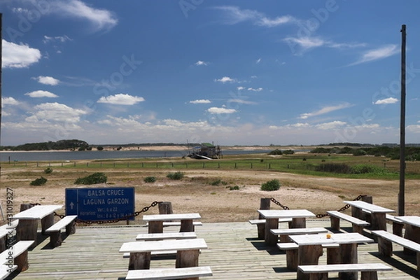 Obraz Translation: Garzon lagoon crossing raft - Hours: summer 6 am to 10 pm - winter 8 am to 12 pm and 2 pm to 6 pm