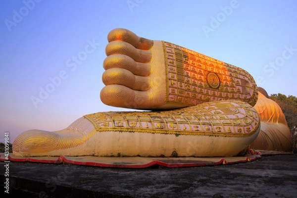 Obraz big buddha footprint and many symbol on the foot with clear sky in wat phra that suthon Mongkhon Khiri temple, province Phrae in Thailand.