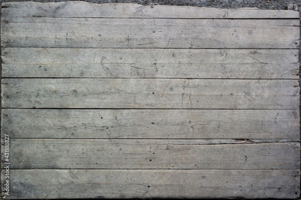 Fototapeta Texture of old rough unpainted planks on the old wooden pallet surface with nails