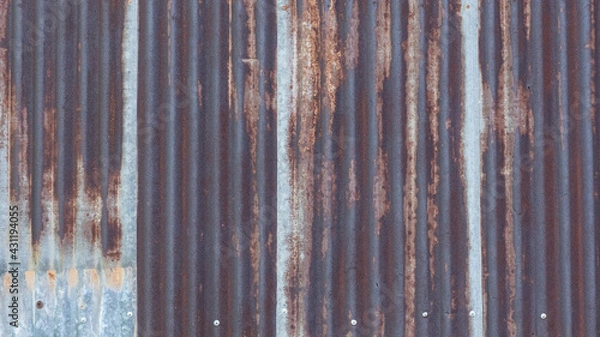 Fototapeta Rusted zinc, taken as a background behind the mill.