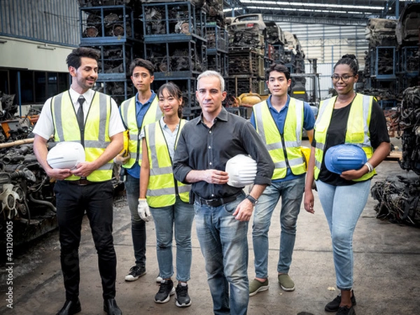 Fototapeta Portraits of dedicated and dedicated auto parts warehouse teams include female engineers and male technicians within working environments.