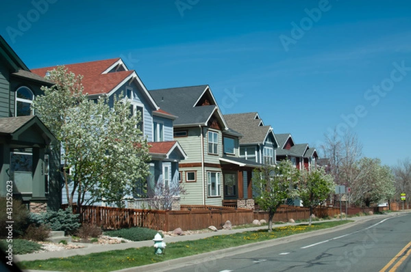 Fototapeta Regular street scene without people in a housing area with multiple units including condo or townhouse with balcony or veranda without people in Boulder, Colorado
