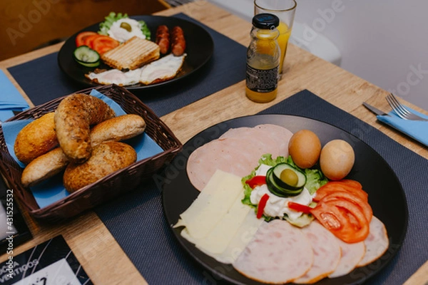 Fototapeta The healthy delicious breakfast served on the table in the cafe. Top view of healthy delicious breakfast served on the table in the cafe.