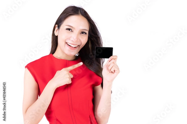 Obraz A beautiful woman in a red dress Showing a happy expression On a white background, A lovely woman holding a name card and point her hand to show something