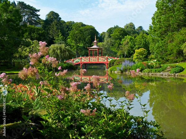 Fototapeta The colourful Chinese Bridge in the parkland over the lake at Apremont in the Loire Valley France
