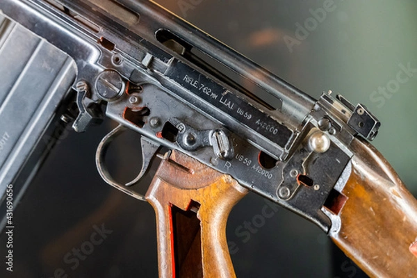 Fototapeta Close up of 7.62mm rifle. Black coloured, broken apart with the parts exposed
