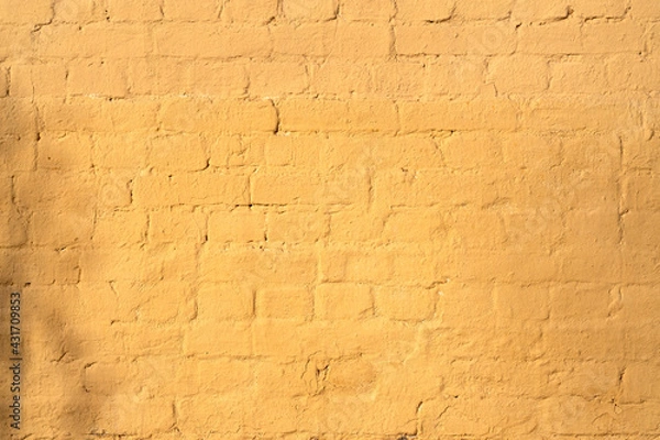 Obraz Old rough yellow brick wall texture. Background