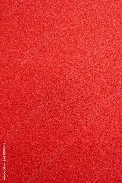 Fototapeta Textured surface red paper with sparkles, defocused. Abstract holiday shiny background, design element