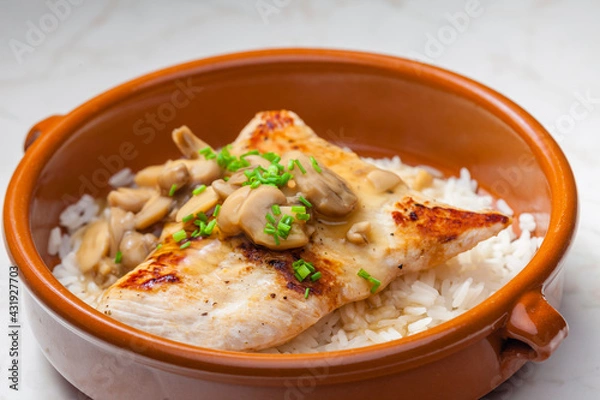 Fototapeta grilled turkey fillet with mushroom sauce and rice