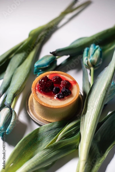 Obraz Cheesecake with berries on a white background