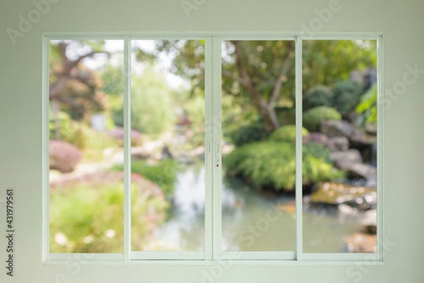 Fototapeta garden view outside through the window