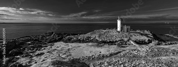 Obraz lighthouse on the shore of the sea