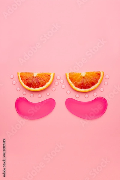 Fototapeta Hydrogel patches for the eyes. Pink under eye patches with collagen on pink background. The concept of beauty, cosmetics for skin care around the eyes, lifting, beauty salon.