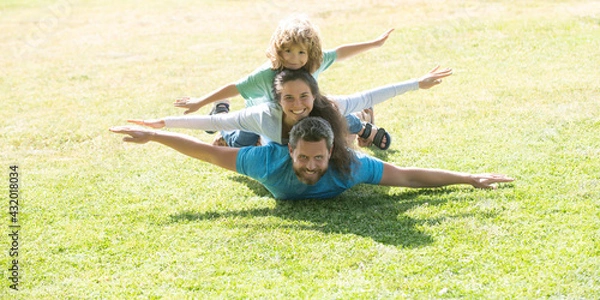 Fototapeta Family and child outdoors in spring nature. Banner panorama with copy space for text.