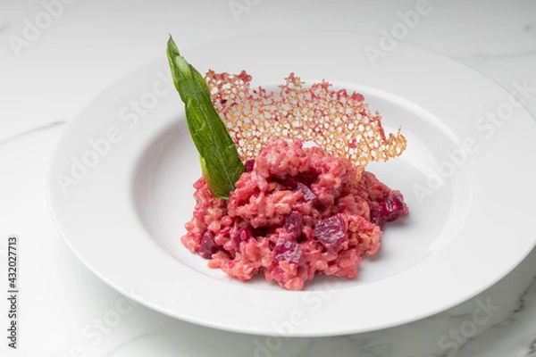 Fototapeta Beetroot risotto. Italian pink risotto