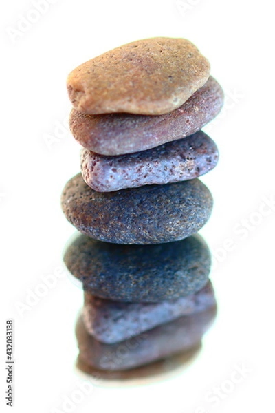 Fototapeta A stack of stones on a mirror

