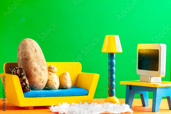 Fototapeta A quirky metaphorical concept image showing a potato family lying on a couch watching tv in a living room setting. Image for being couch potato, obesity, sedentary lifestyle and health effects.