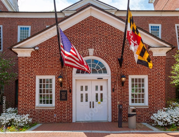 Fototapeta Close up isolated image of the entrance of Maryland State Senate Office Complex in a beautiful garden on a sunny spring day. The complex is located near State House in the capital city of Annapolis.