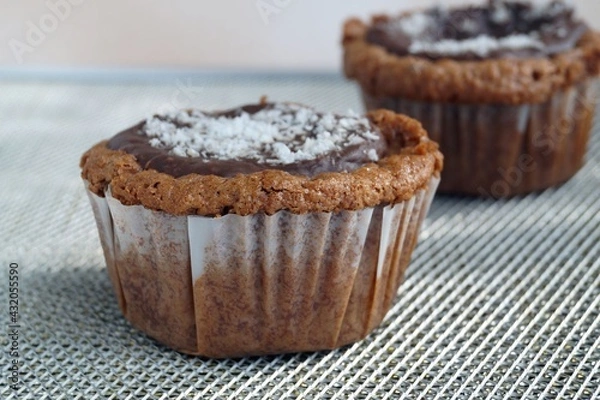 Obraz Two chocolate muffins with coconut flakes