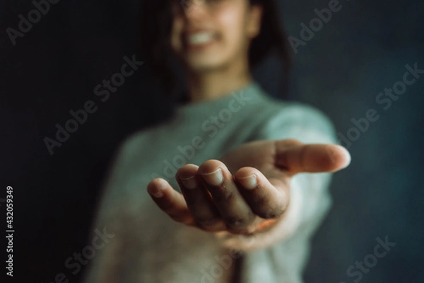 Fototapeta Woman giving hands to the camera, help and self help concept, mental health
