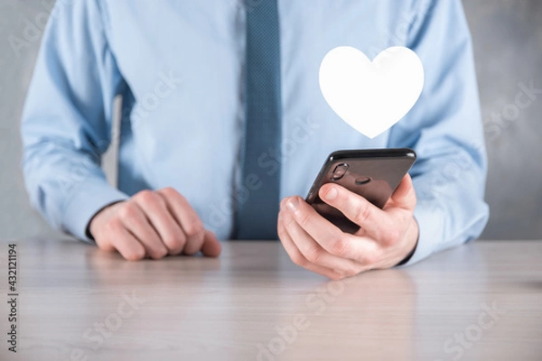 Fototapeta Businessman in shirt holding heart icon symbol