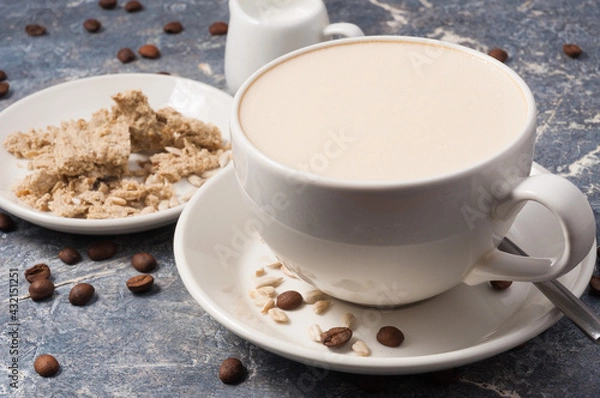 Obraz coffee with milk and halva on a gray background