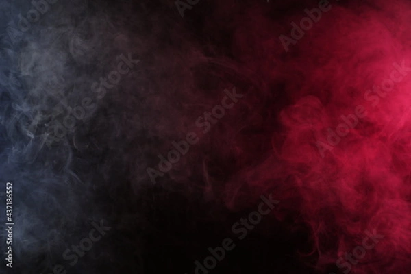 Fototapeta Artificial smoke in white-red light on a black background