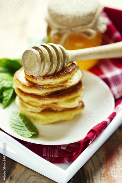 Fototapeta stack of pancakes with honey