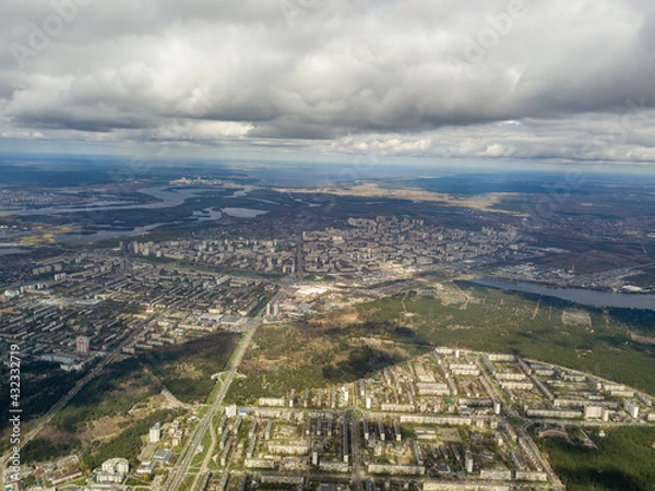 Fototapeta The city of Kiev in cloudy weather. Aerial high view.