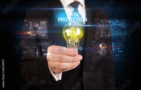 Fototapeta Businessman holding a light bulb, online security concept