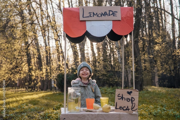 Obraz toddler girl selling lemonade in kids little lemonade stand