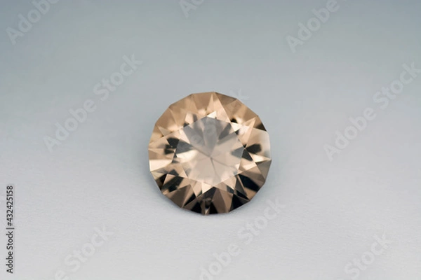 Fototapeta Natural genuine round faceted brown color smoky quartz transparent gemstone setting for making jewelry. Front view. Gradient background. Gemology theme.