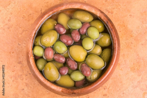 Obraz plate with olives on a light background