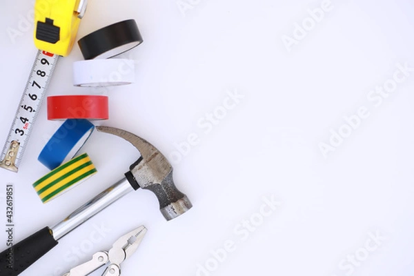 Obraz Top view of Set of construction and maintenance tooling for handyman on white concrete background with copy space